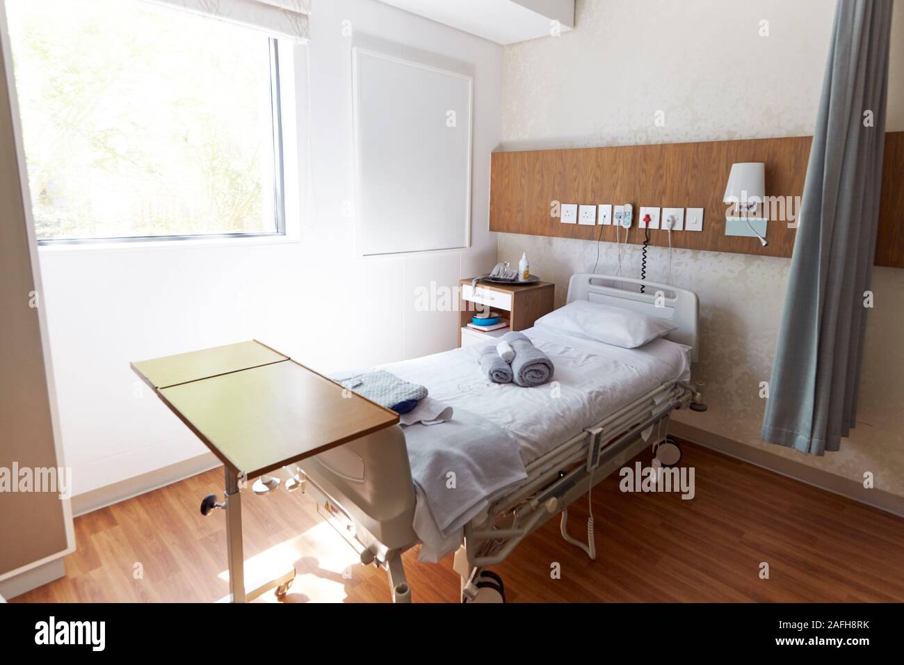 Bed In Empty Hospital Private Room Stock Photo