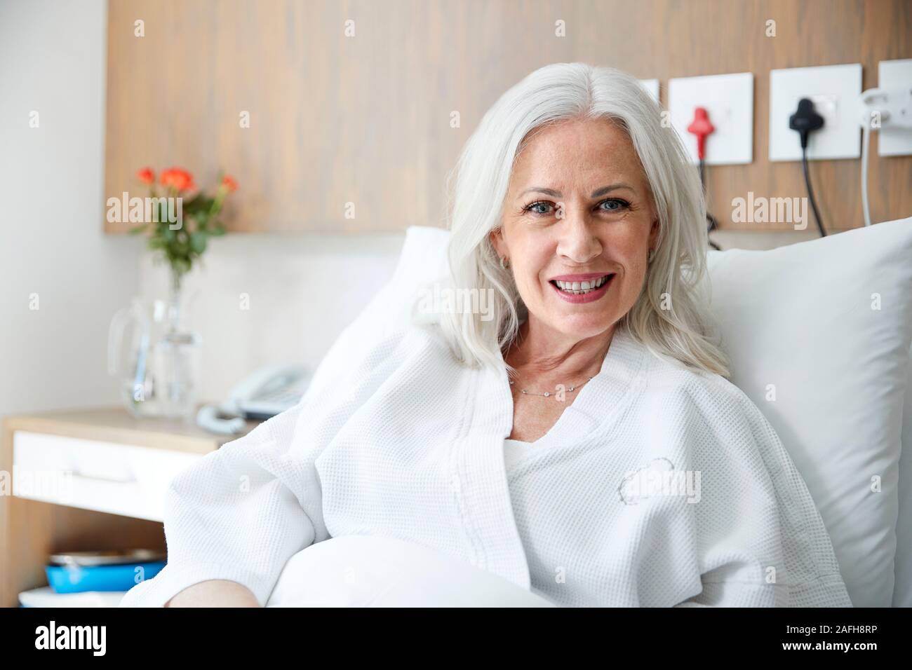 Mature woman in bed hi-res stock photography and images - Alamy