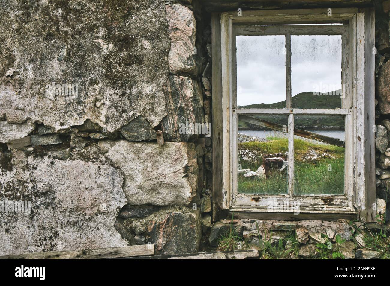 View through window of abandoned crofters house, isle of Lewis and Harris, Outer Hebrides, Scotland Stock Photo