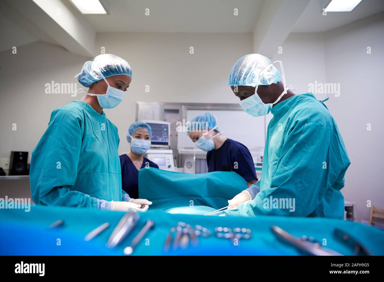 Surgical Team Working On Patient In Hospital Operating Theatre Stock ...