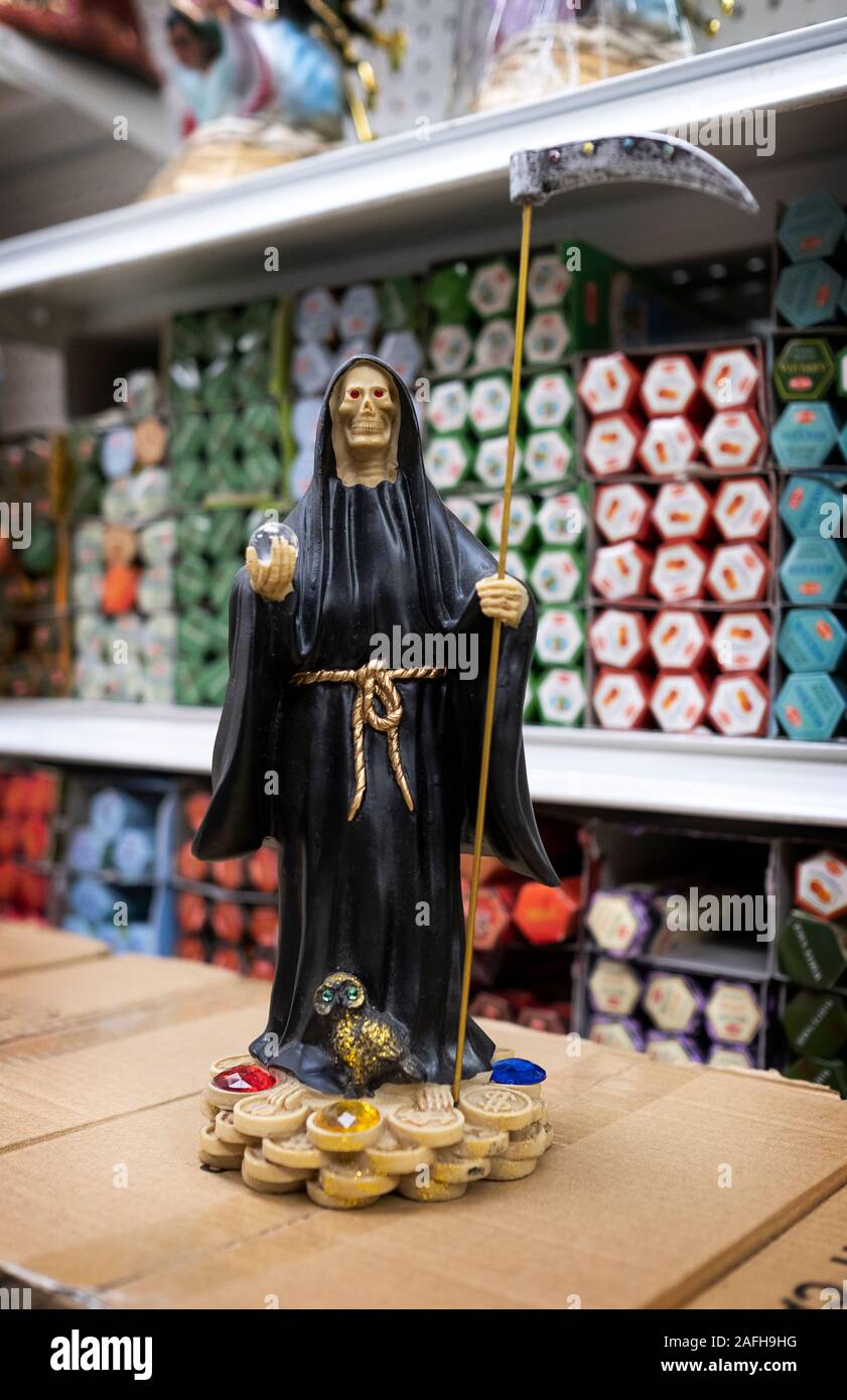 Santa Muerte statues for sale at Candalaria Botanica, a store on Roosevelt Ave selling religious items to a primarily a South American population. Stock Photo