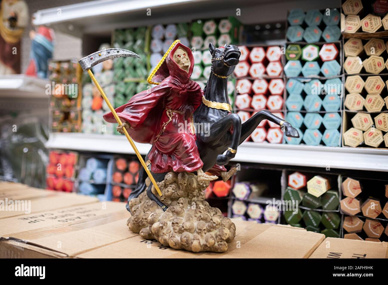Santa Muerte statues for sale at Candalaria Botanica, a store on Roosevelt Ave selling religious items to a primarily a South American population. Stock Photo