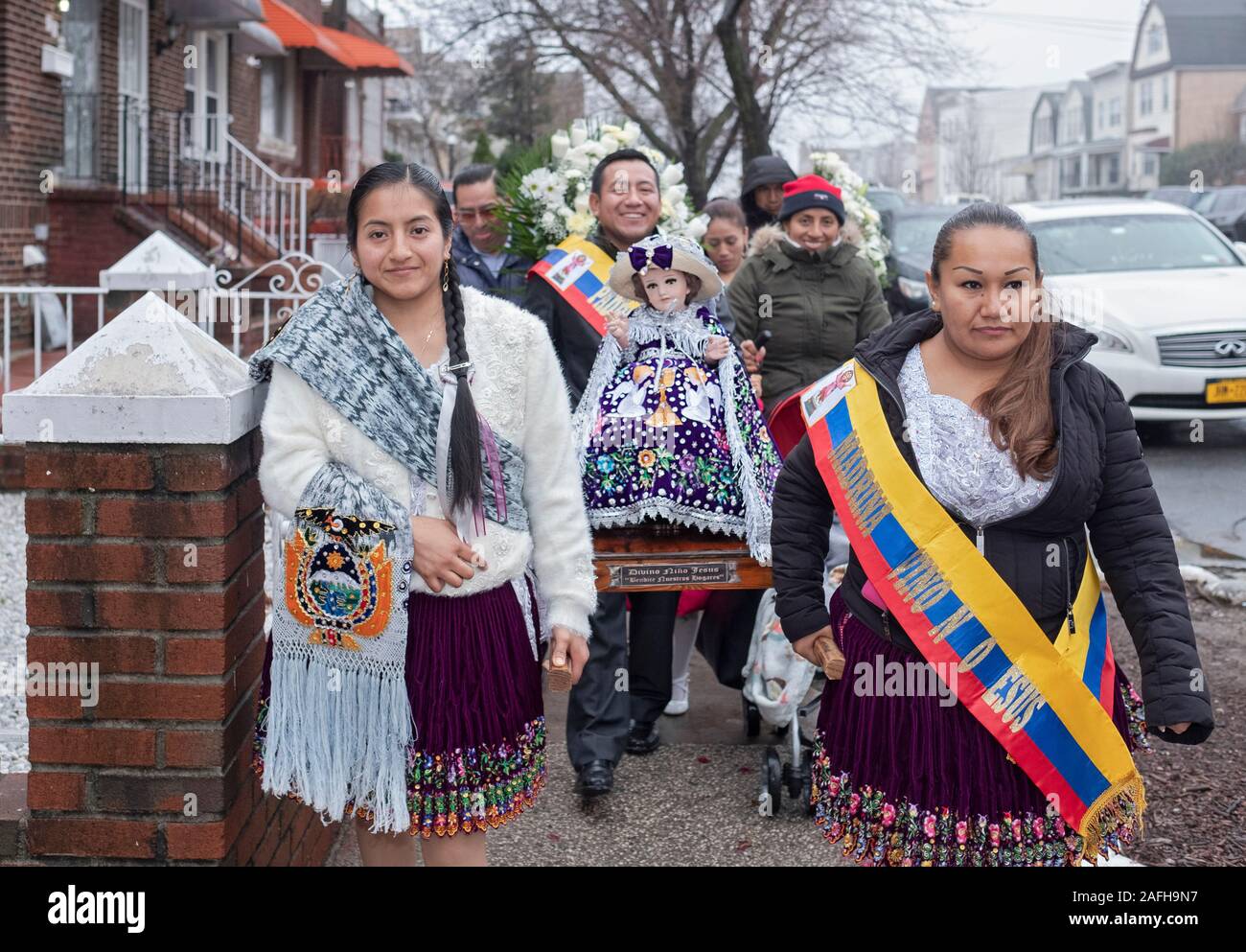 Ecuadorian Americans Catholics in a mid December march with statues of Baby Jesus to celebrate the birth of Christ. In Corona, Queens, New York City. Stock Photo