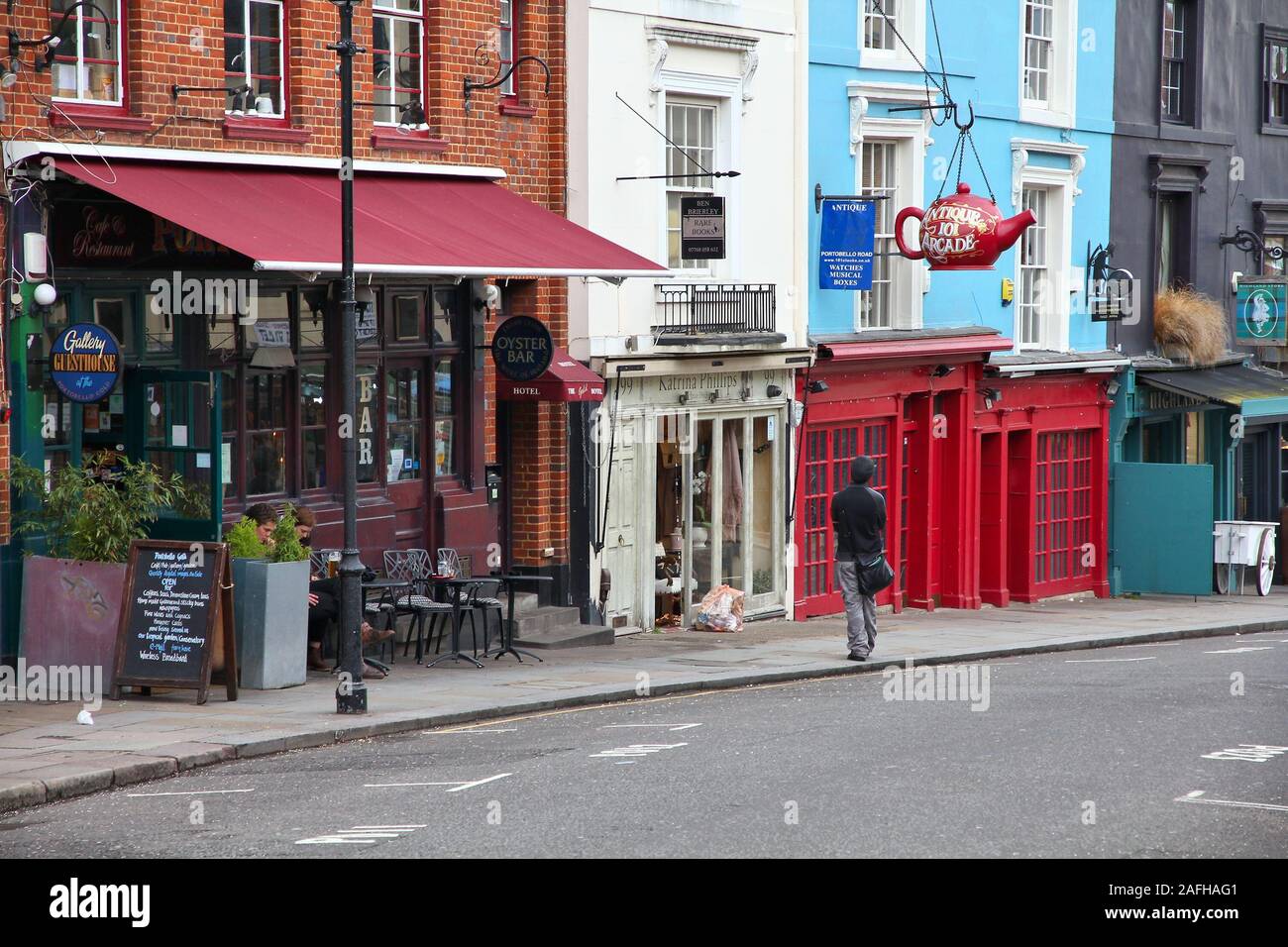 LONDON, UK - MAY 14, 2012: People visit Portobello Road in Notting Hill, London. Portobello Road Market at Notting Hill currently is one of top 15 sho Stock Photo