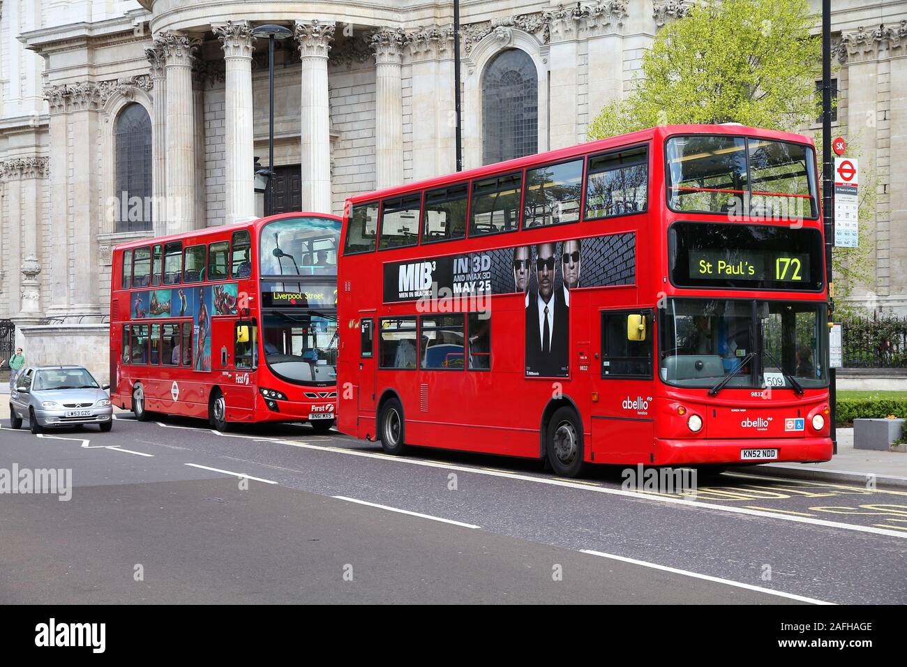 LONDON, UK - MAY 13, 2012: People ride London Buses in London. Part of city public transportation, London Buses carry 6 million people on a week day. Stock Photo