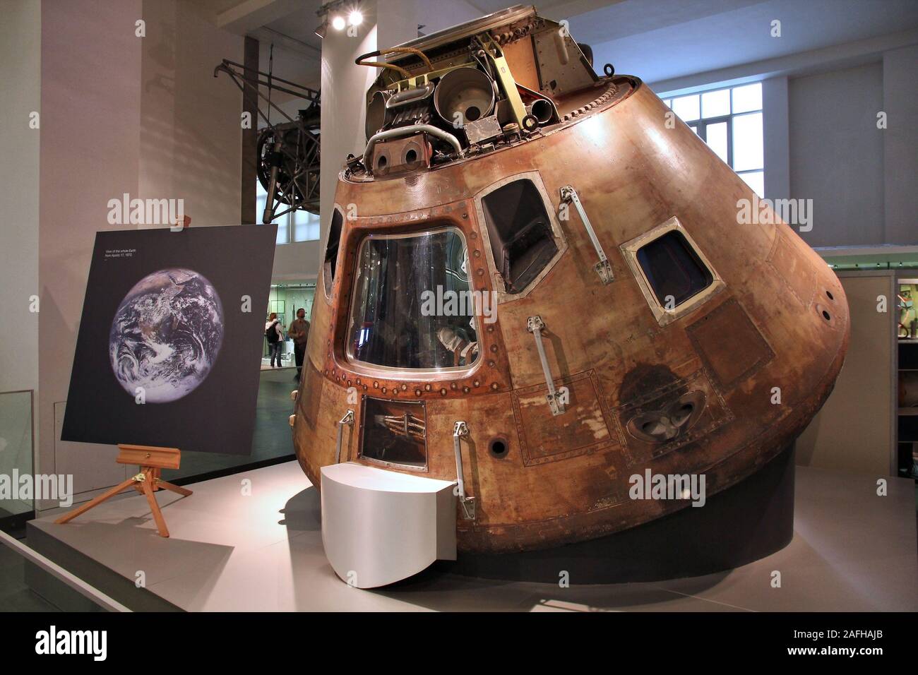 LONDON, UK - MAY 14, 2012: Visitors admire Apollo 10 space capsule at Science Museum in London. With almost 2.8 million annual visitors it is the 5th Stock Photo