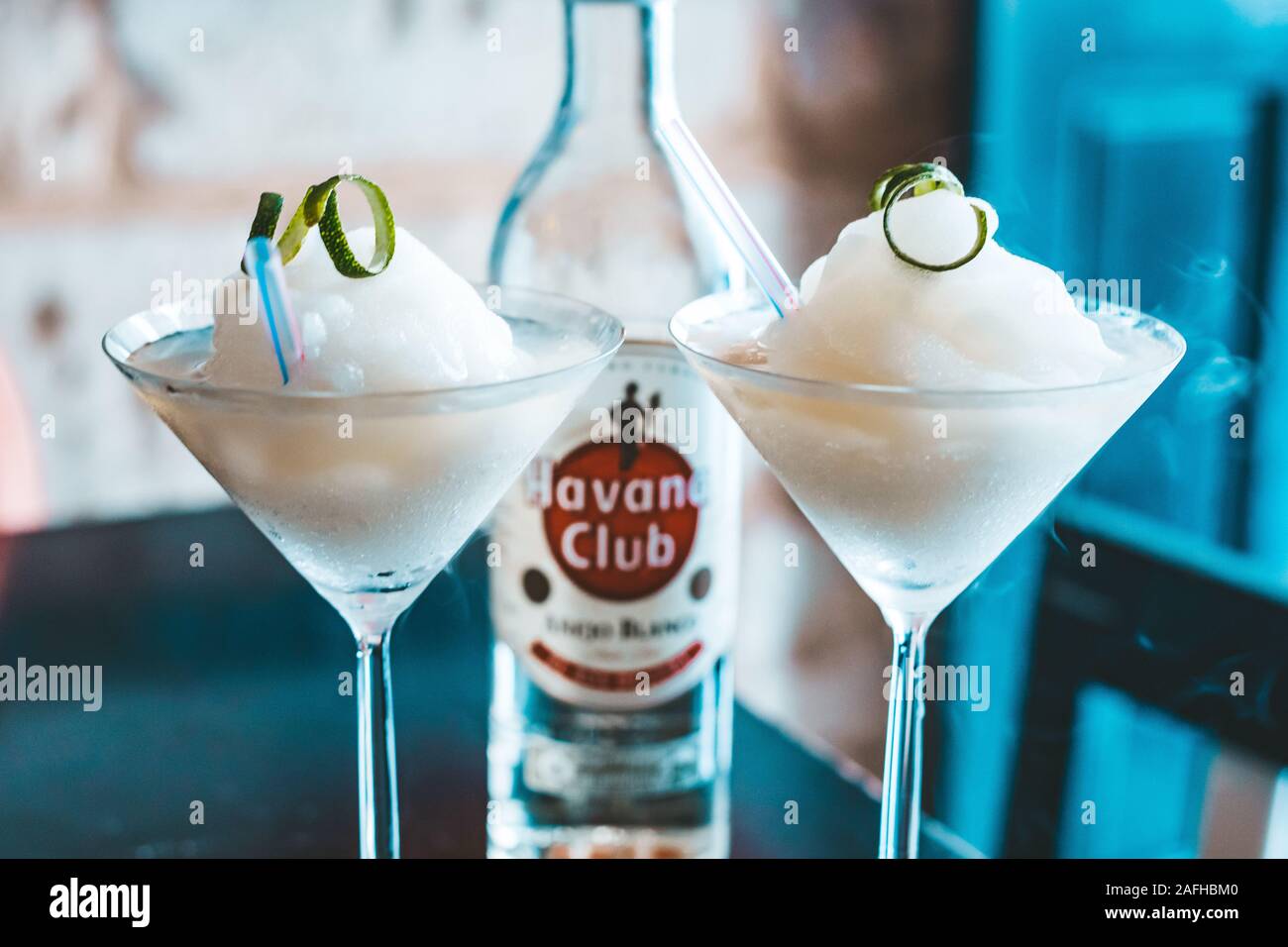 Havana, Cuba - October 18, 2019: Classic Daiquiri Cocktail with Bottle of Havana Club rum. Stock Photo
