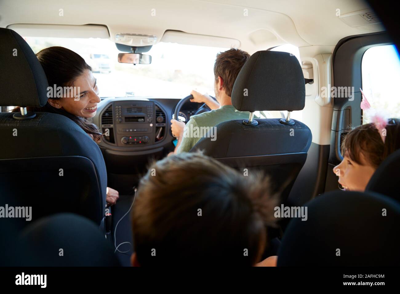 Young white family making a trip in their car, close up, back view car interior shot Stock Photo