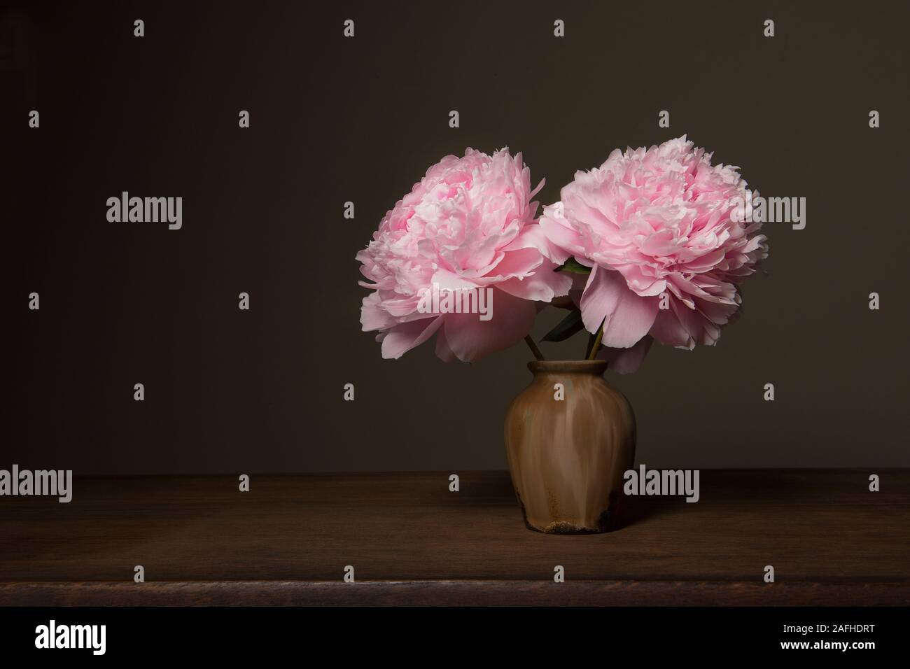 Still life with blooming peony roses in fine art style Stock Photo
