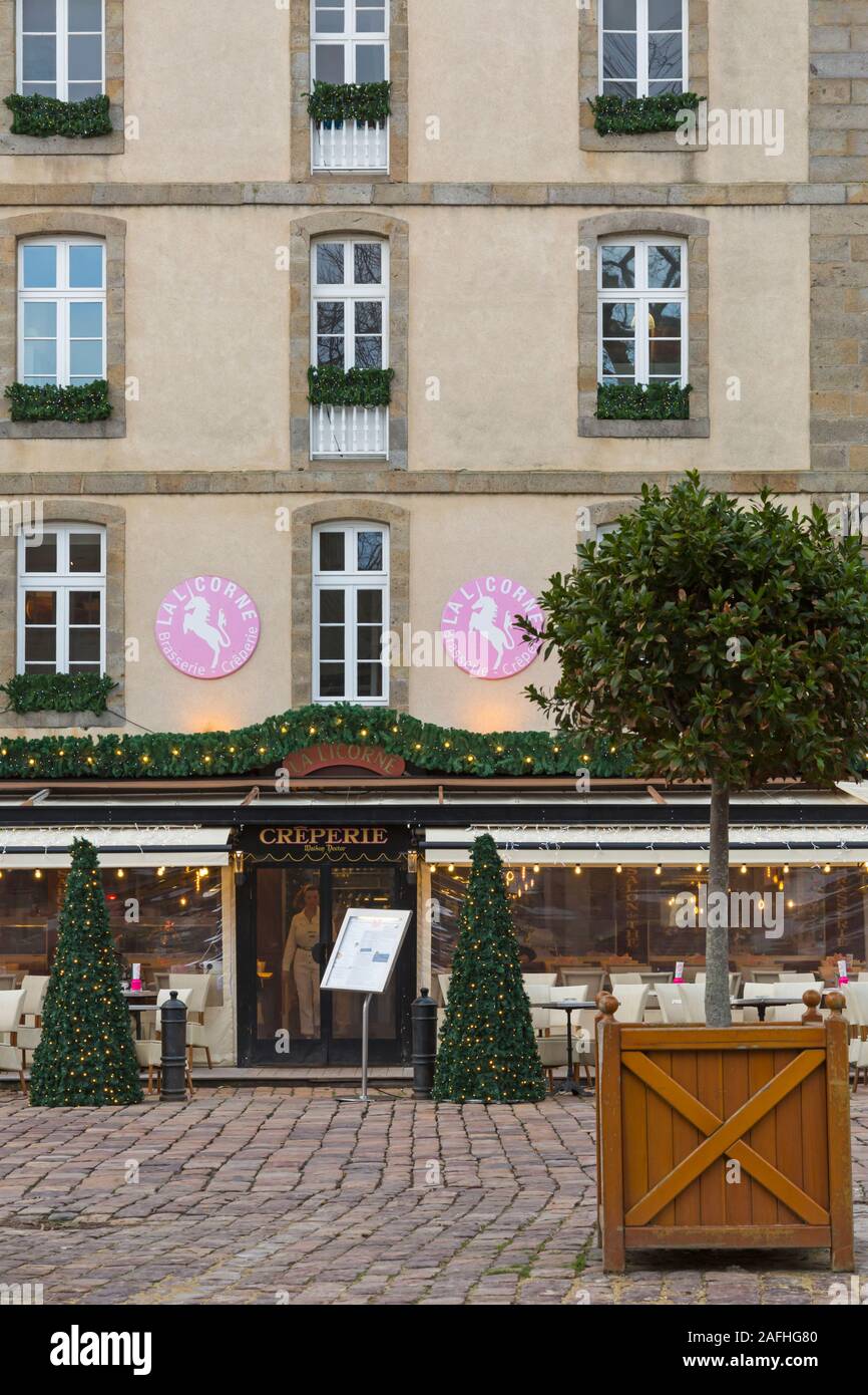 La Licorne (French for Unicorn) brasserie creperie restaurant at Place Chateaubriand, old town, St Malo, Saint Malo, Brittany, France in December Stock Photo