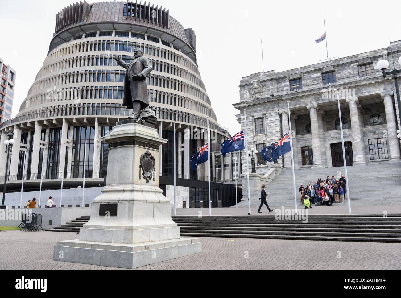 Wellington, New Zealand. 16th Dec, 2019. The New Zealand's national flags fly at half-mast in front of the parliament buildings to commemorate the victims of the White Island volcanic eruption in Wellington, New Zealand, on Dec. 16, 2019. Questions need to be asked and answered with regard to the casualties caused by the White Island volcanic eruption, said New Zealand Prime Minister Jacinda Ardern on Monday. People across New Zealand observed a one-minute silence on Monday in honor of the victims of the White Island volcanic eruption. Credit: Guo Lei/Xinhua/Alamy Live News Stock Photo