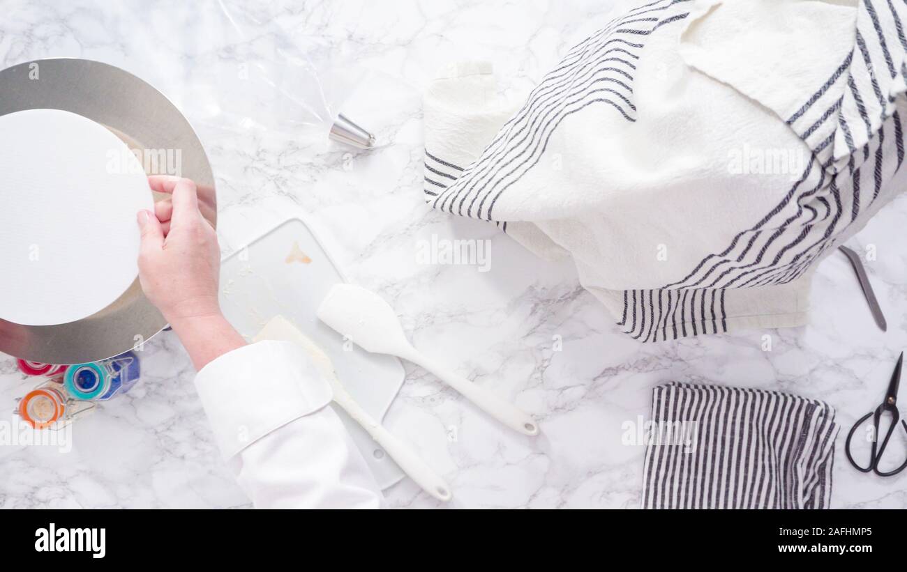 Mixing ingredients in standing kitchen mixer to make buttercream