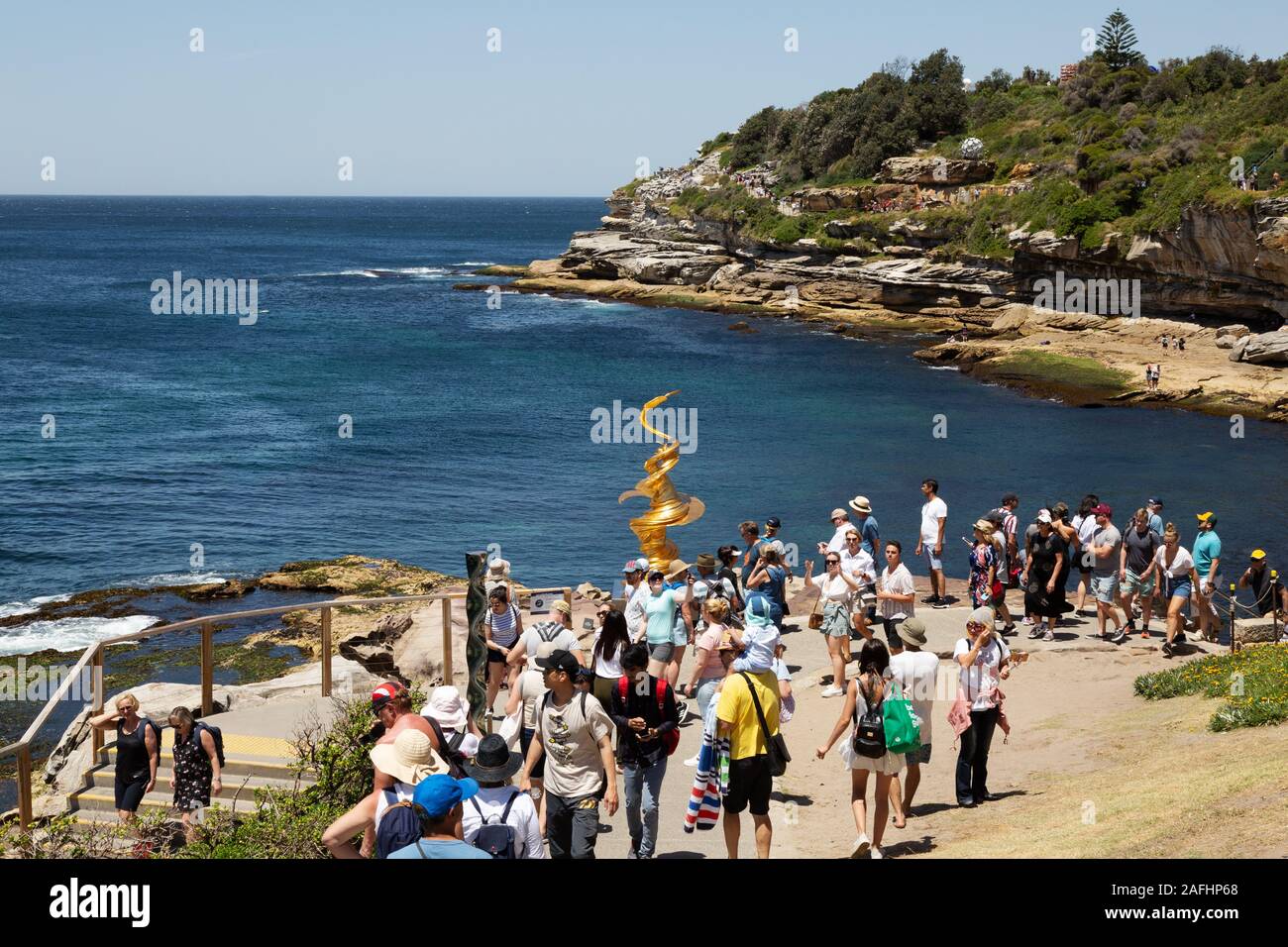 People walking on the Bondi Sculpture by the Sea walk from Bondi to Tamarama beaches, Sydney Australia Stock Photo