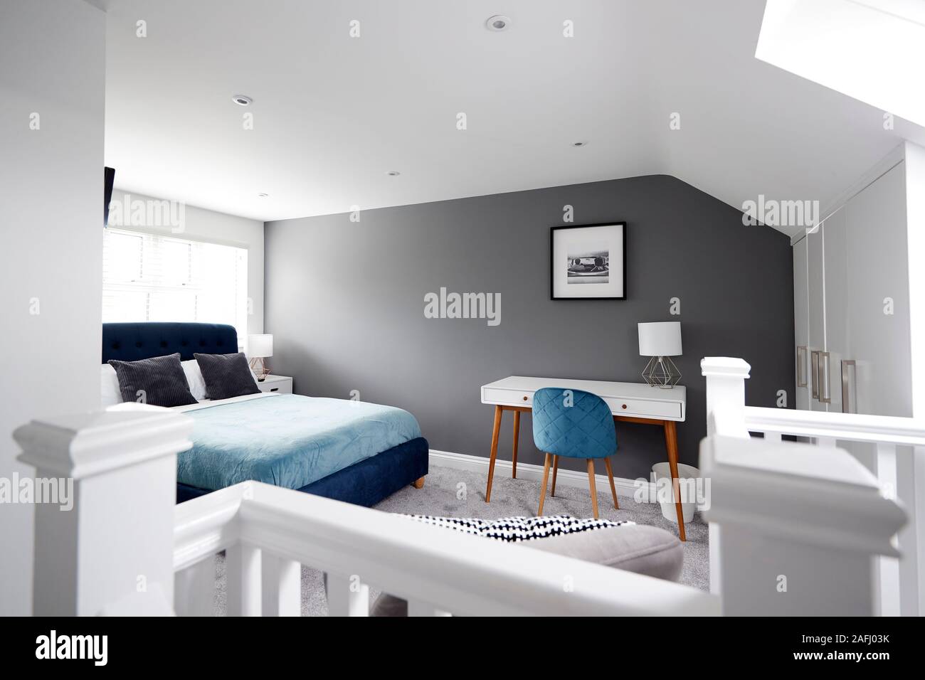 Interior of a house, loft conversion bedroom seen across stair banister