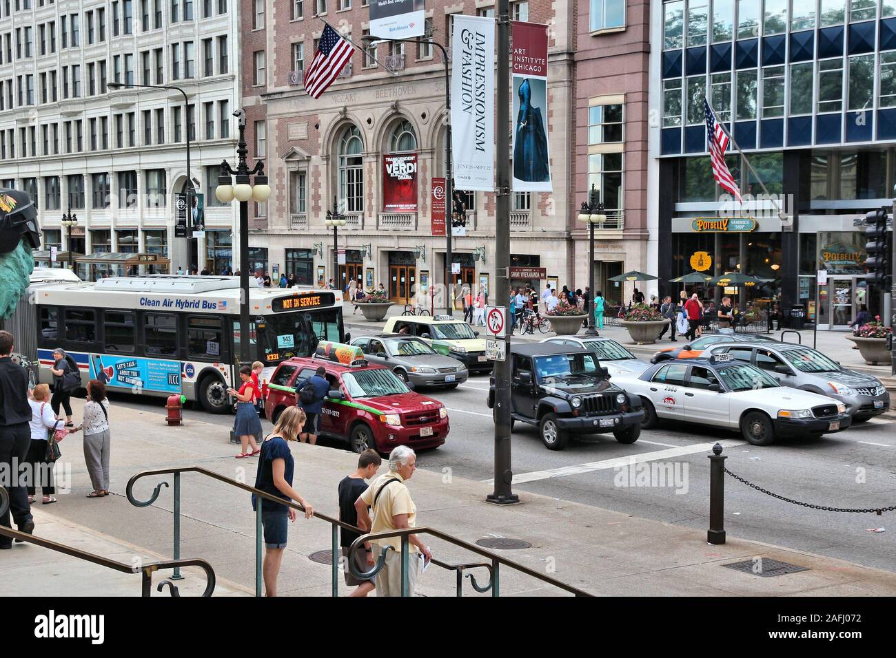 CHICAGO, USA - JUNE 28, 2013: People drive in traffic at Michigan Avenue in downtown Chicago. Chicago is the 3rd most populous US city with 2.7 millio Stock Photo