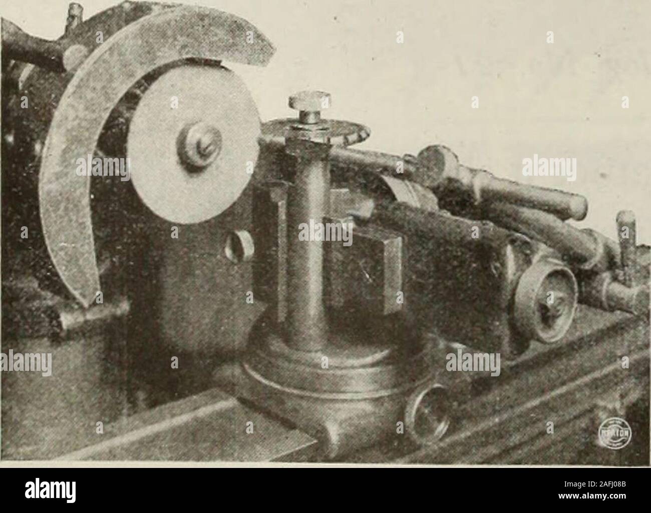 . Canadian machinery and metalworking (January-June 1919). oundon the face only. It is important that theoperator keep the cutting edge in a radialline to retain the shape. In this particulartype of cutter, it is necessary to do the grind-ing with the tooth-rest on the back of thecutting tooth instead of on the face. Cutters of the side-mill type are groundon the top in exactly the same manner as theplain cutter. A cup wheel is employed forgrinding the sides, the cutter being held on theedges of a special arbor, as shown in the illus-tration. For plain milling cutters, the wheels mostused are Stock Photo