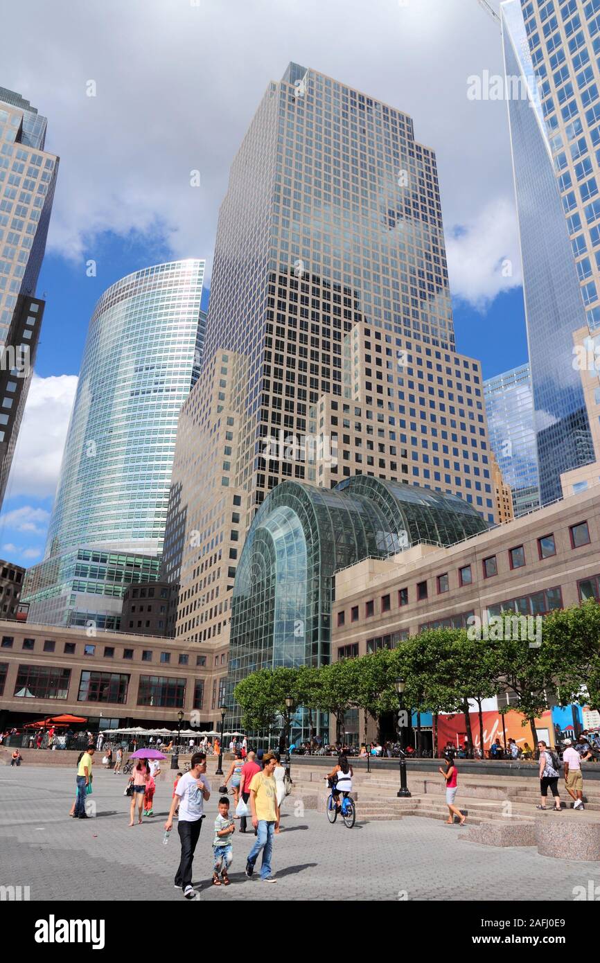 NEW YORK, USA - JULY 4, 2013: People walk by 200 Vesey Street, formerly known as Three World Financial Center in New York City. It is the world headqu Stock Photo