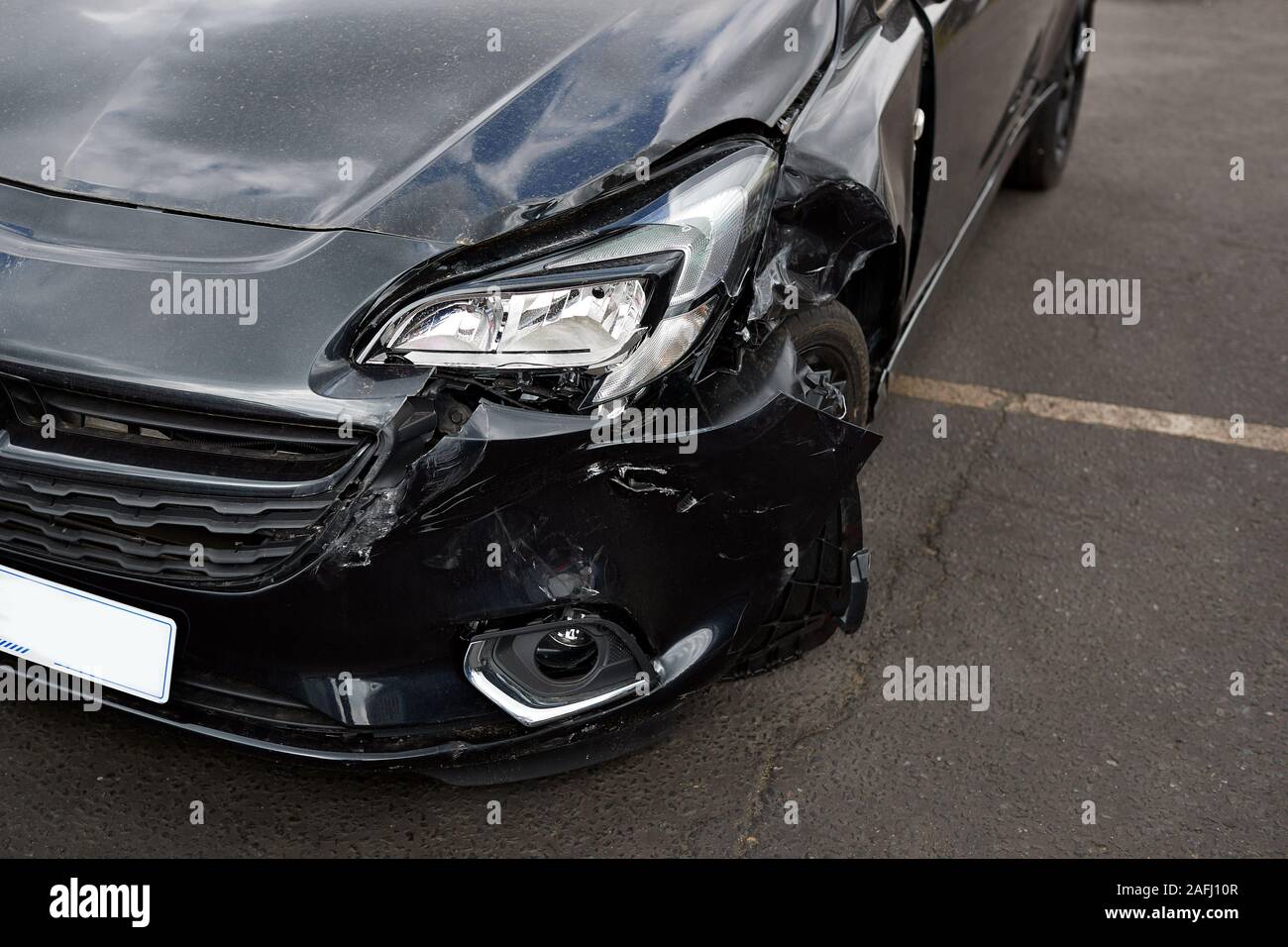 Detail Of Damage To Headlight Of Vehicle In Car Park Stock Photo