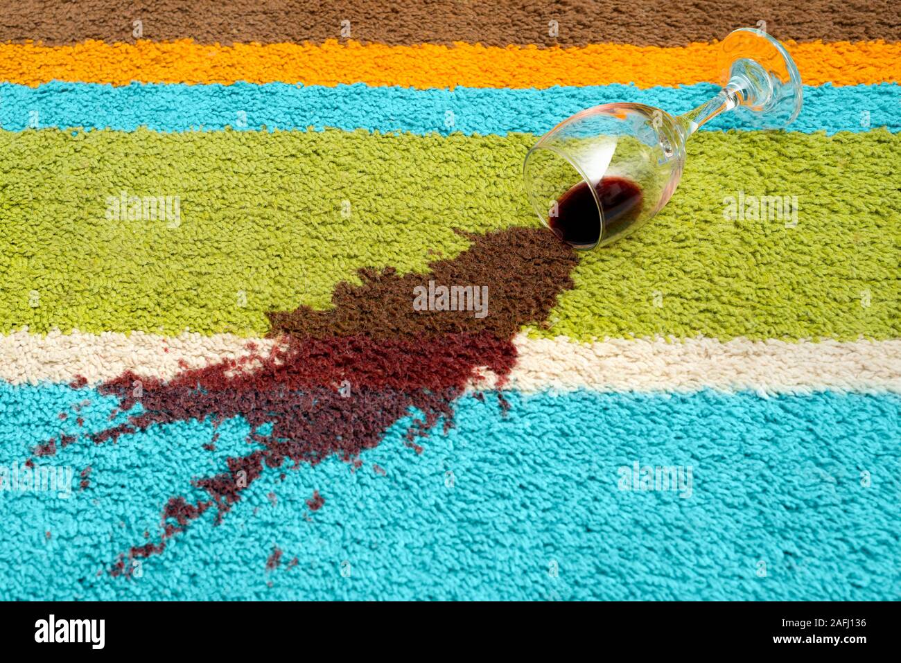 Spill of red wine over the carpet Stock Photo