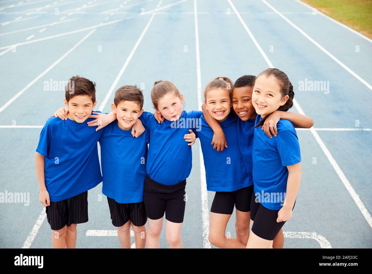 Portrait Of Children In Athletics Team On Track On Sports Day Stock Photo