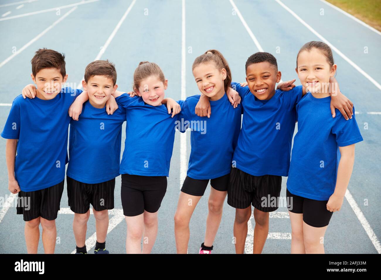 Portrait Of Children In Athletics Team On Track On Sports Day Stock Photo