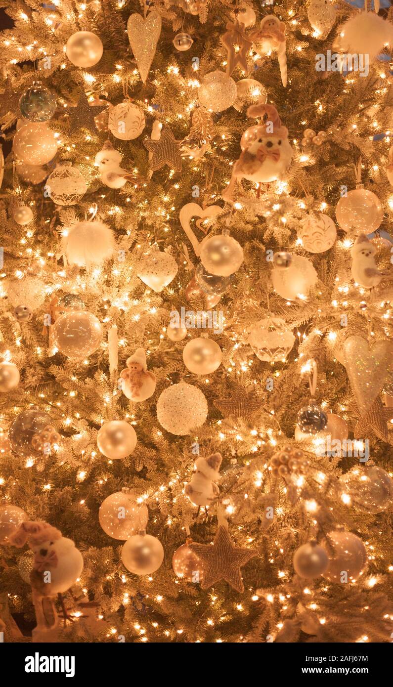 Christmas tree decoration close up, golden sparkling bokeh background, vertical Stock Photo