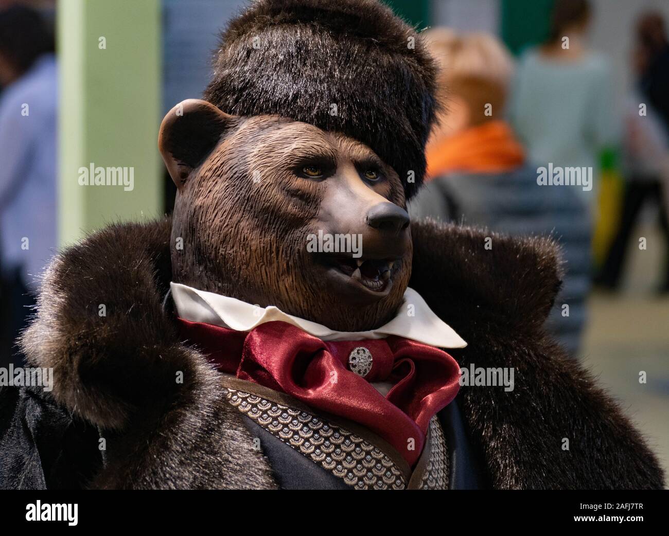 Bear in a fur coat and hat Stock Photo - Alamy
