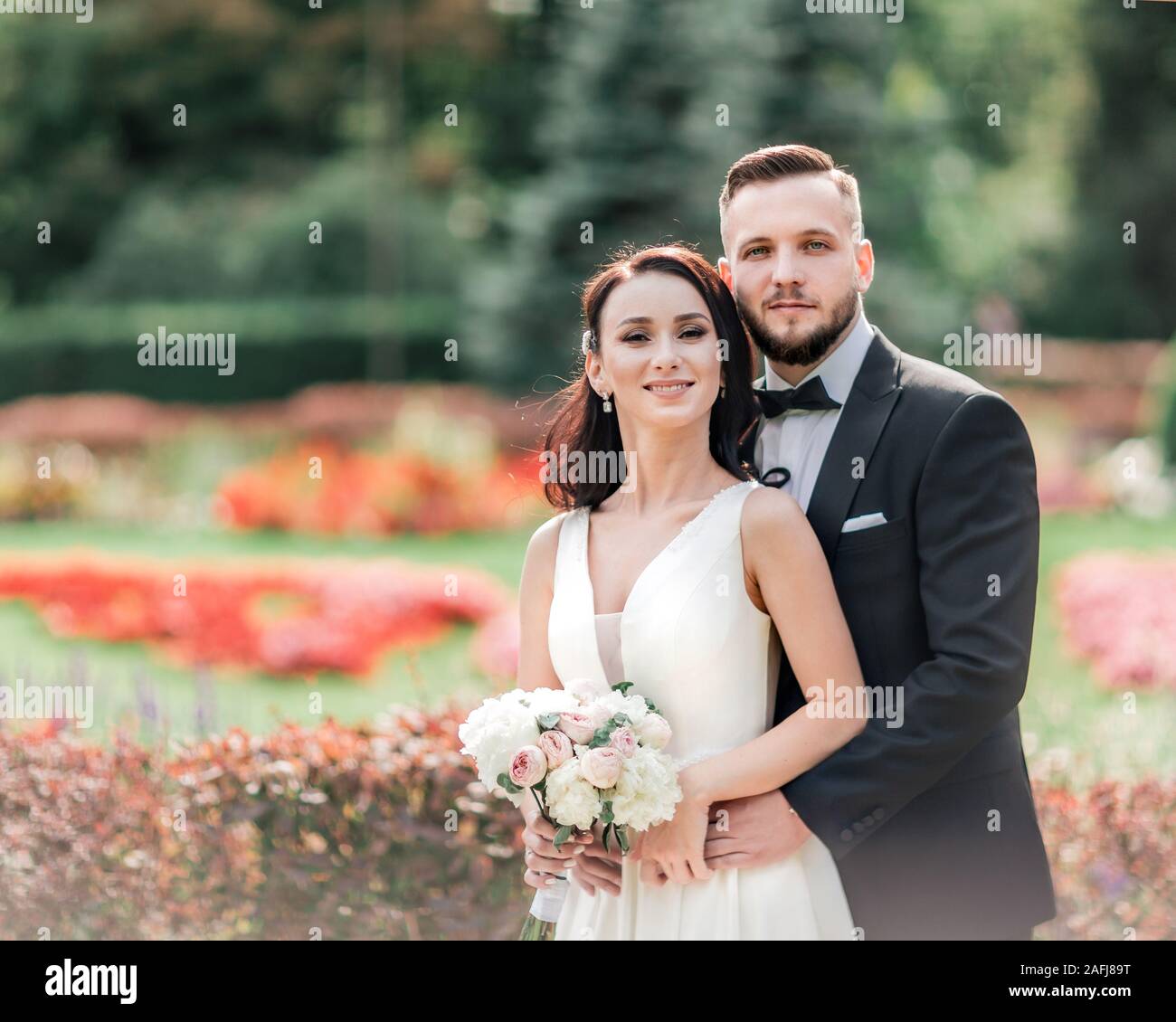 portrait of happy bride and groom on their wedding day Stock Photo - Alamy