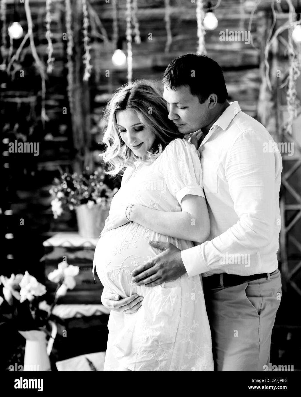 Loving husband gently hugging his pregnant wife Stock Photo - Alamy