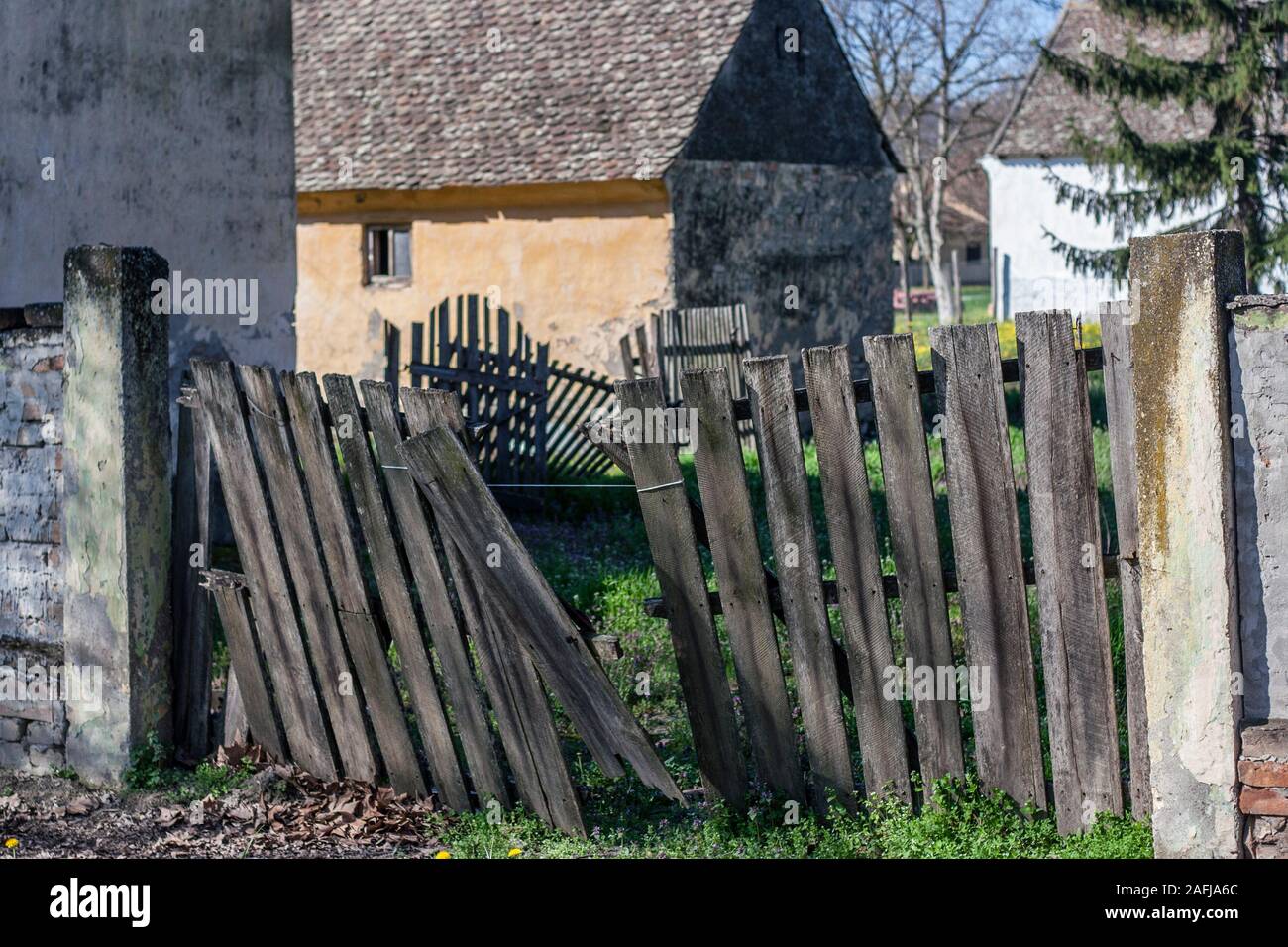 demolished village fence in front of the yard, village Ivanovo, Serbia Stock Photo