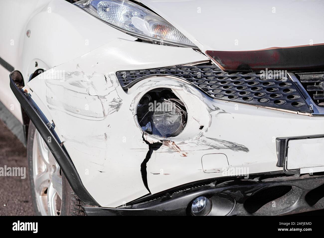 Inspection of the car after an accident on the road. The front fender