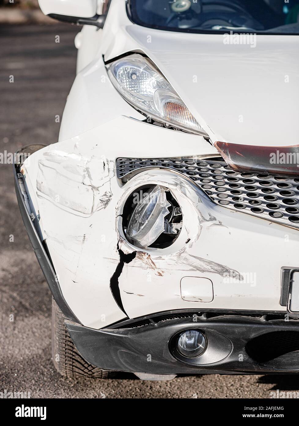 Inspection of the car after an accident on the road. The front fender