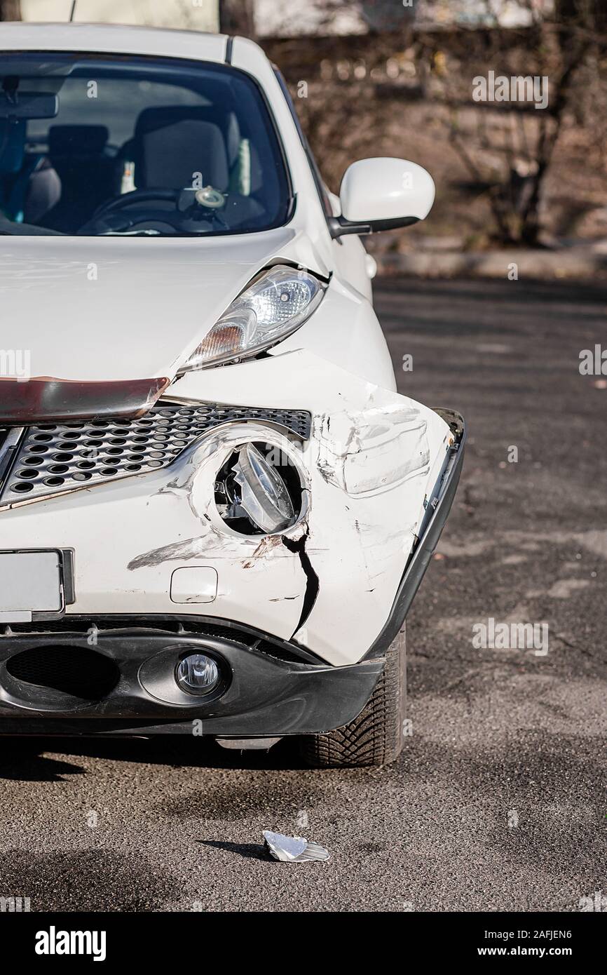 Broken Car after a Crash. Damaged Wing and Headlamp of a Car