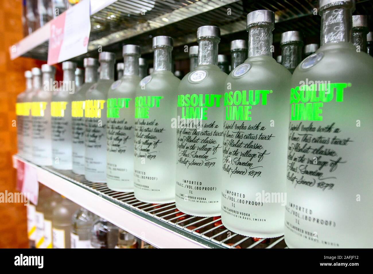 Aruba, 12/2/2019: Bottles of Absolut Lime and Absolute Citron vodka stand on a shelf in a liquor store. Stock Photo