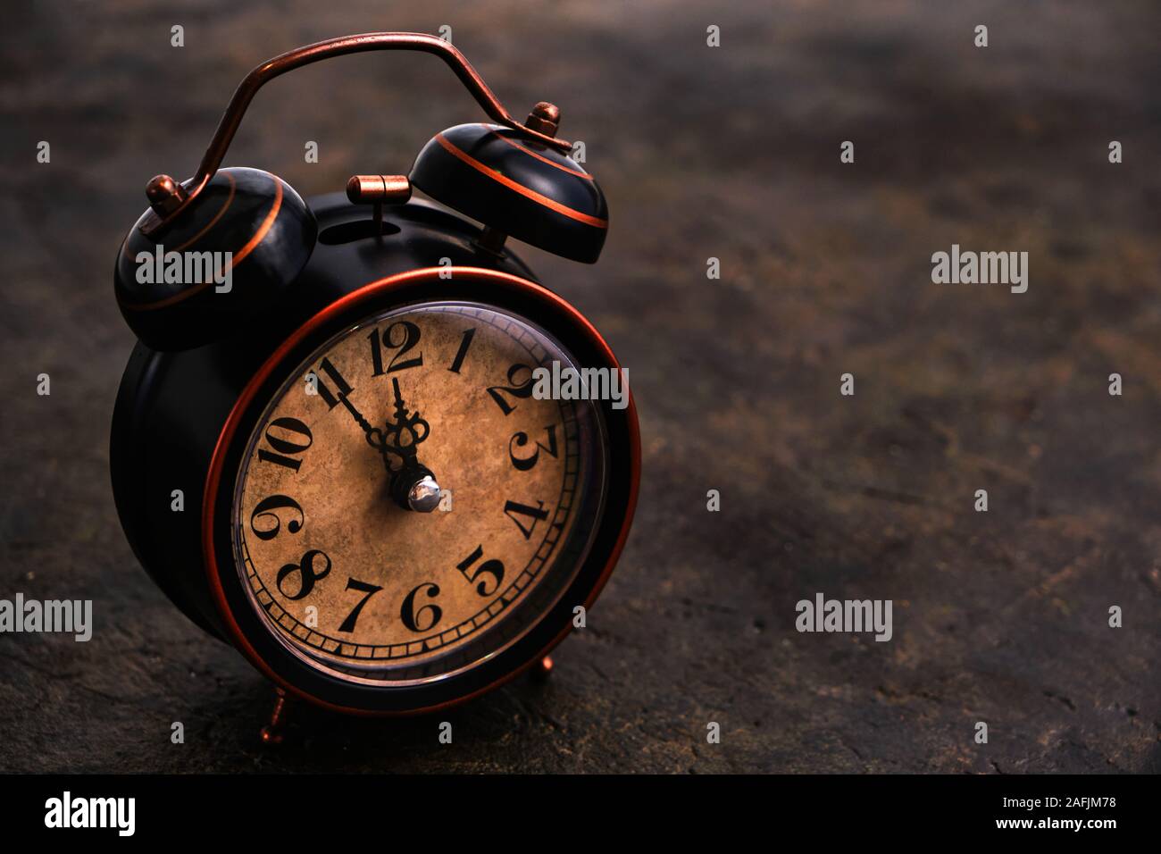 Old retro alarm clock on concrete vintage background Stock Photo - Alamy