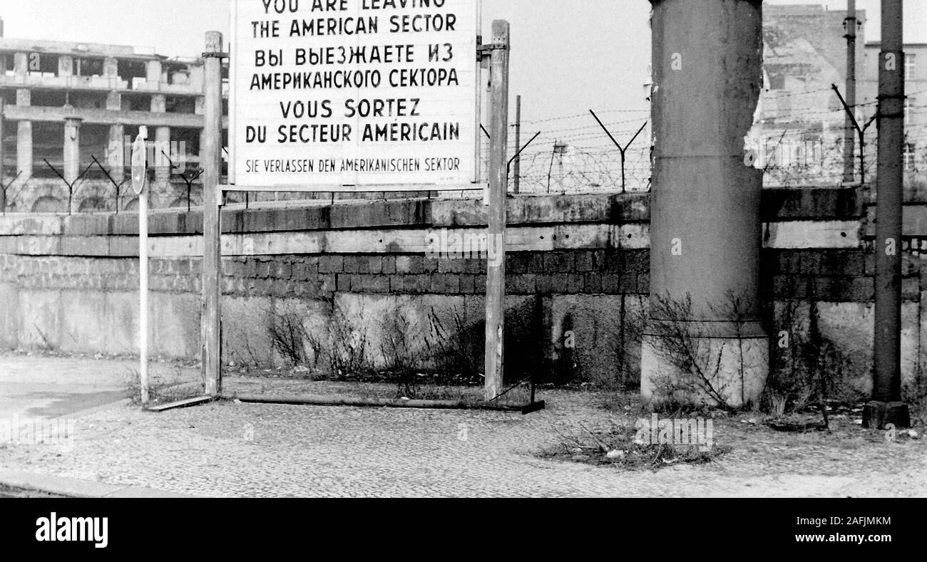 The Berlin wall near Potsdamer Platz in Berlin and in front a sign