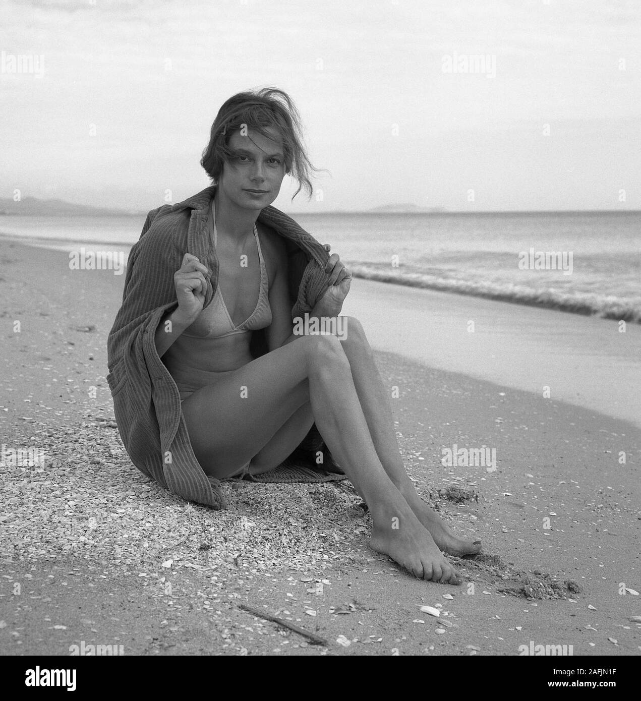 Frau with bikini and jacket at the beach near Tangier Stock Photo Alamy
