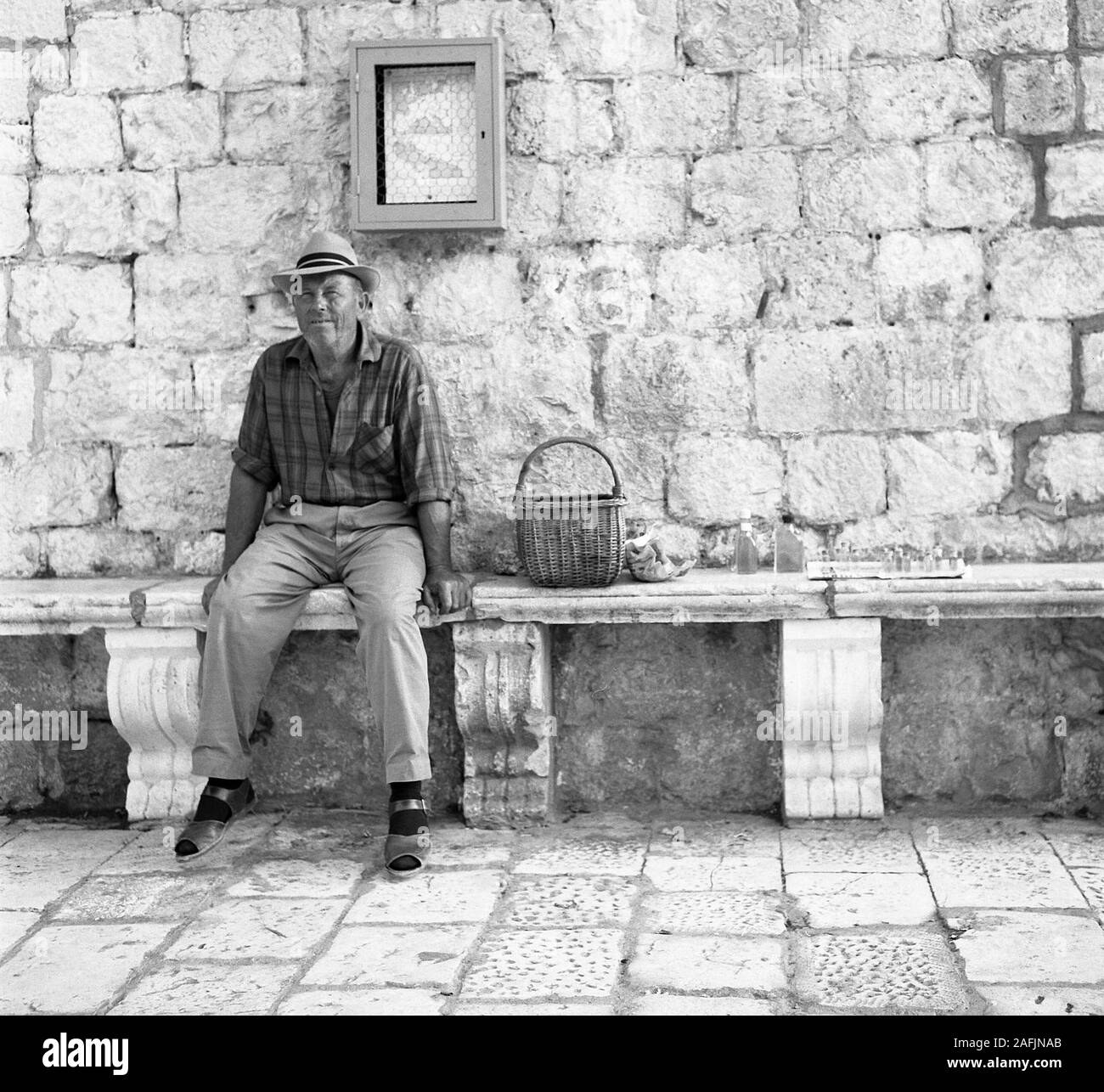 Man sitting on a bench Black and White Stock Photos & Images - Alamy