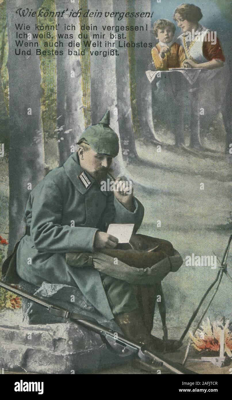Postcard World War One: 'Wie koennt ich dein vergessen!' with postmark from 1916. Picture shows a German soldier writing a card to wife and child. Stock Photo