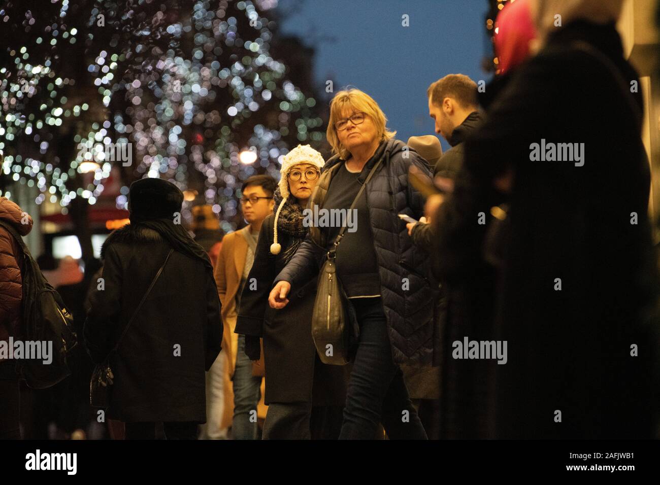 Christmas shoppers doing late Christmas shopping, outside Selfridges, London, UK Stock Photo
