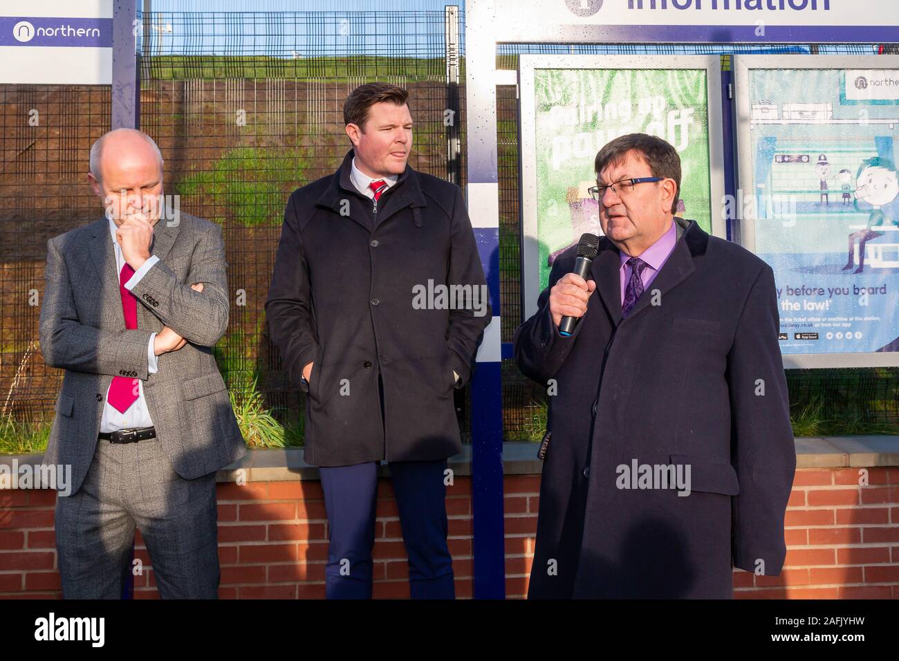 Warrington, Cheshire, UK. 16th Dec, 2019. Professor Steven Broomhead, Chief Executive of Warrington Borough Council, with Russ Bowden, Leader of the council and Thomas Edgcumbe, Managing Director (UKCS North and Midlands) at Balfour Beatty plc, addresses the guests at the official opening of Warrington West Railway Station on 16 December 2019 Credit: John Hopkins/Alamy Live News Stock Photo