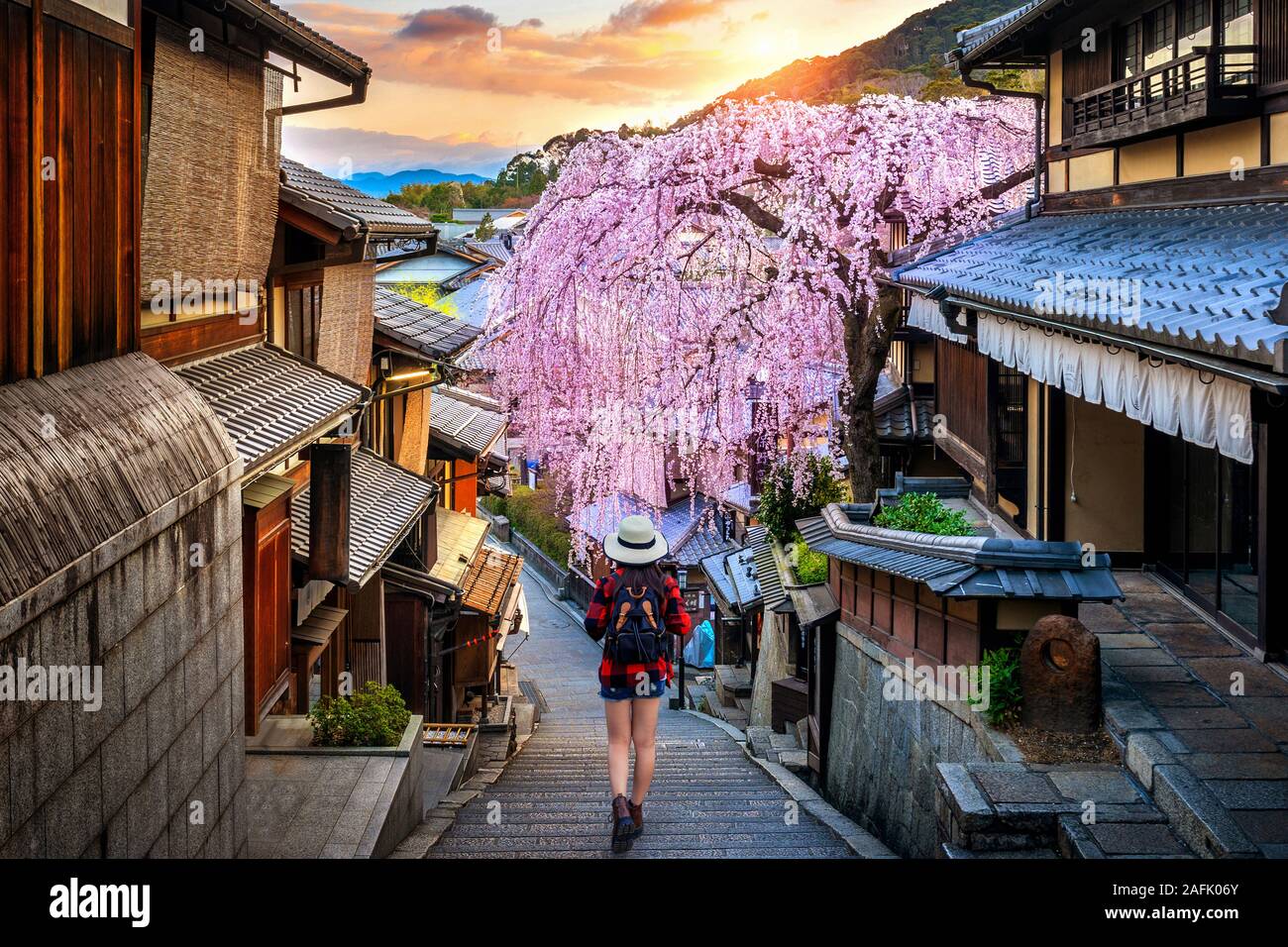Woman traveler with backpack walking at Historic Higashiyama district in spring, Kyoto in Japan. Stock Photo