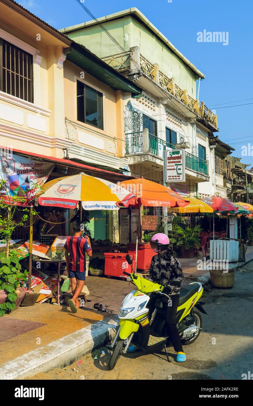 Parasols and scooter on Dragon Street in this colourful old French