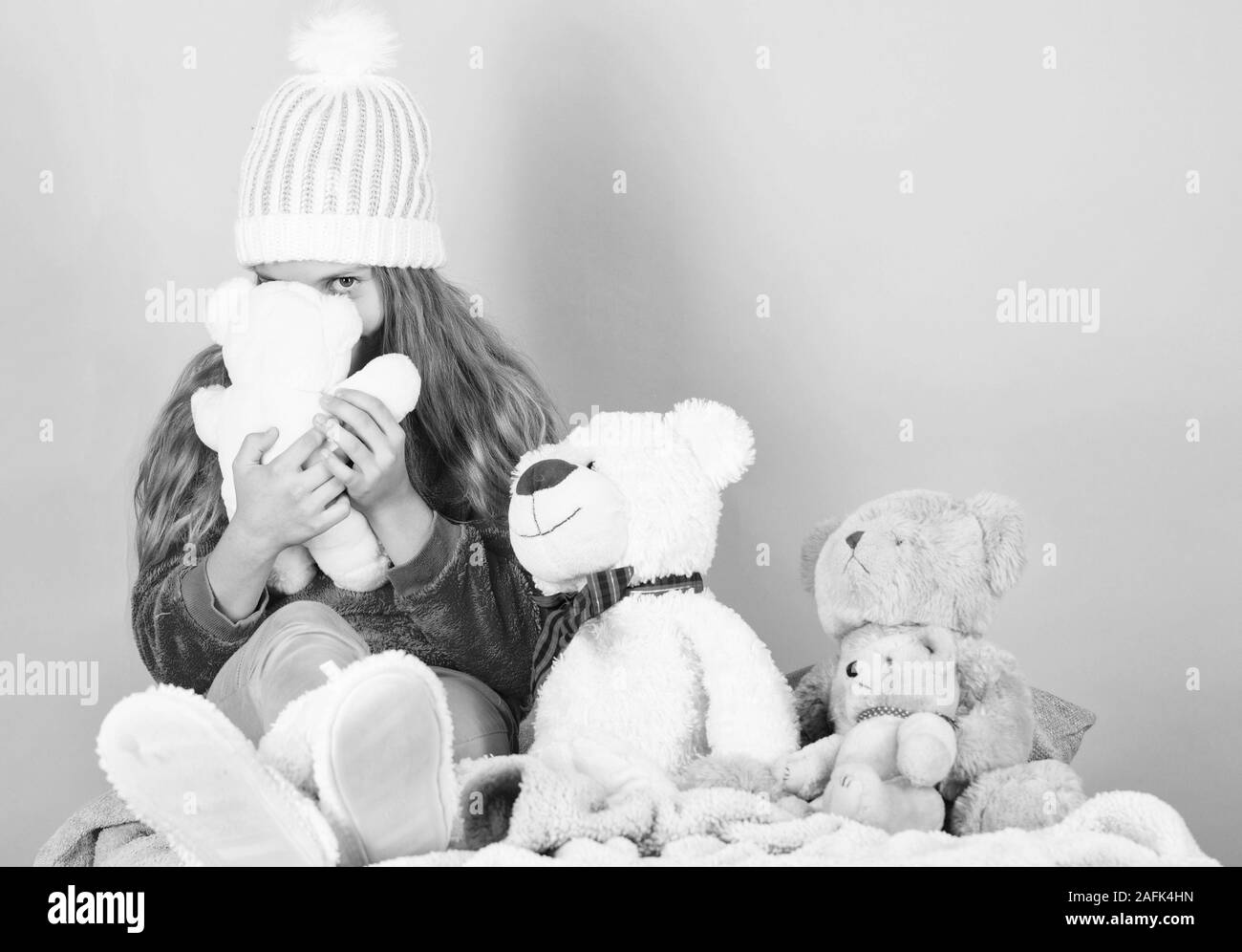 Happy childhood concept. Child small girl playful hold teddy bear plush