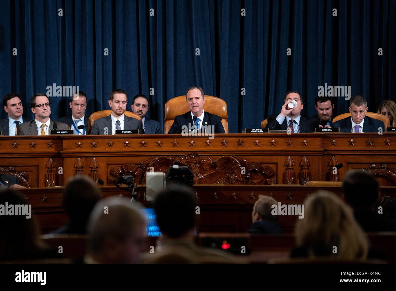 November 20, 2019, Washington, District of Columbia, USA: United States Representative Adam Schiff (Democrat of California), Chairman, US House Permanent Select Committee on Intelligence, left, joined by United States Representative Devin Nunes (Republican of California), Ranking Member, US House Permanent Select Committee on Intelligence, right, gives closing remarks during a US House Intelligence Committee impeachment inquiry hearing with Laura Cooper, deputy assistant secretary of defense for Russia, Ukraine and Eurasia, and David Hale, undersecretary of state for political affairs, on Capi Stock Photo