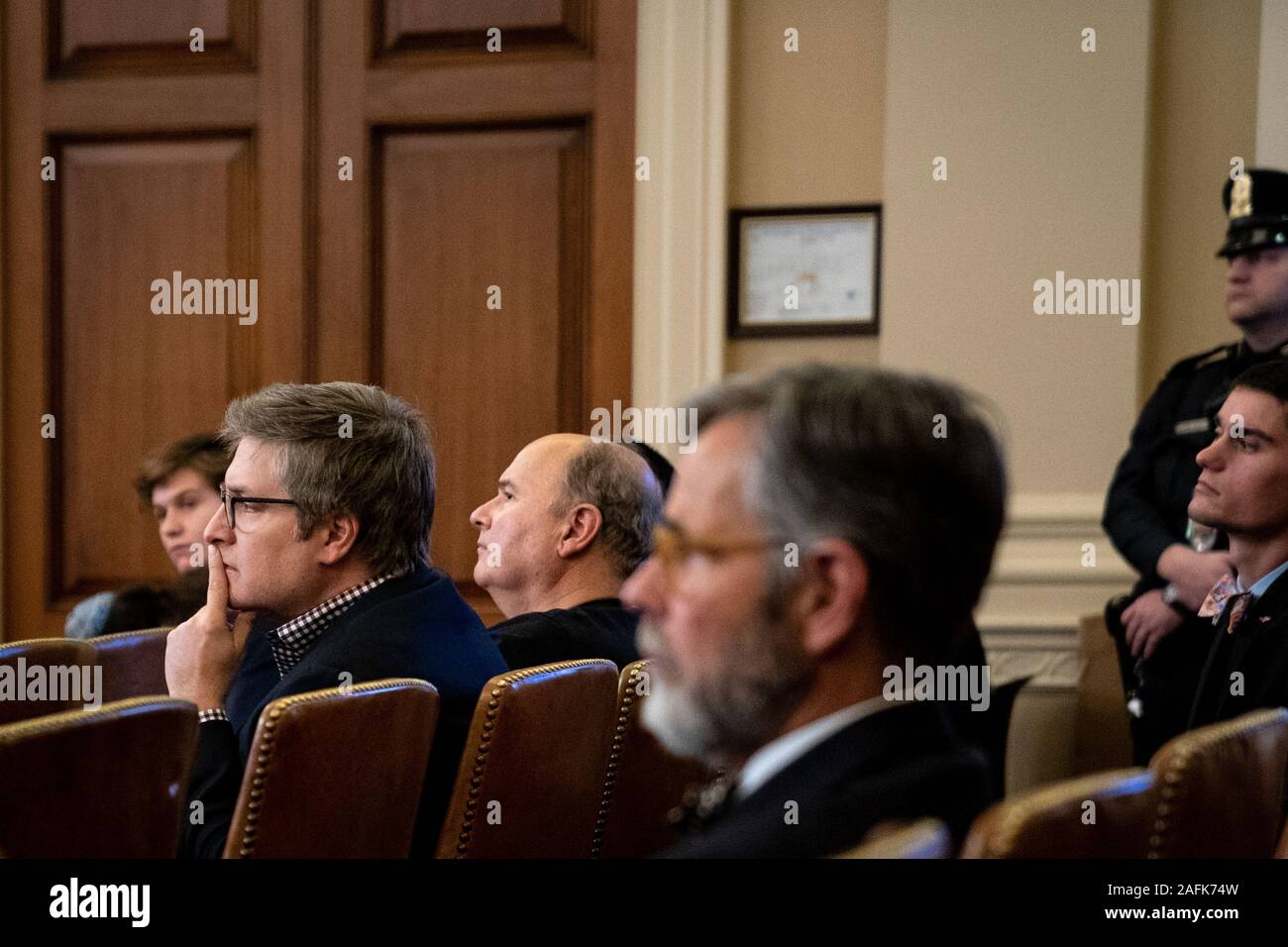 People in the audience watch a United States House Intelligence Committee impeachment inquiry hearing with Laura Cooper, deputy assistant secretary of defense for Russia, Ukraine and Eurasia, and David Hale, undersecretary of state for political affairs, on Capitol Hill in Washington, DC on November 20, 2019. Credit: Erin Schaff/Pool via CNP Stock Photo
