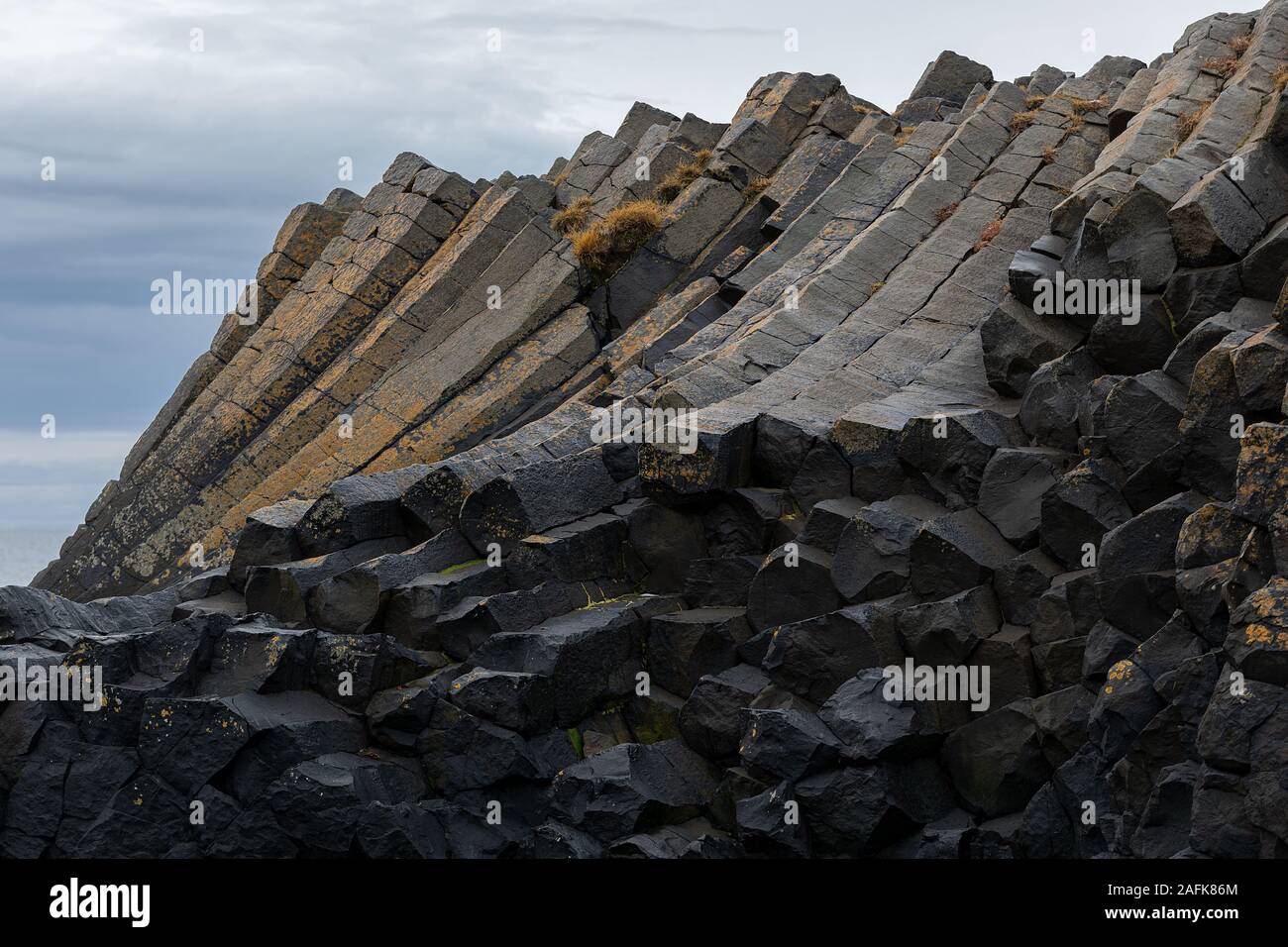 Basaltic columns in Kálfshamarsviti lighthouse in Iceland Stock Photo