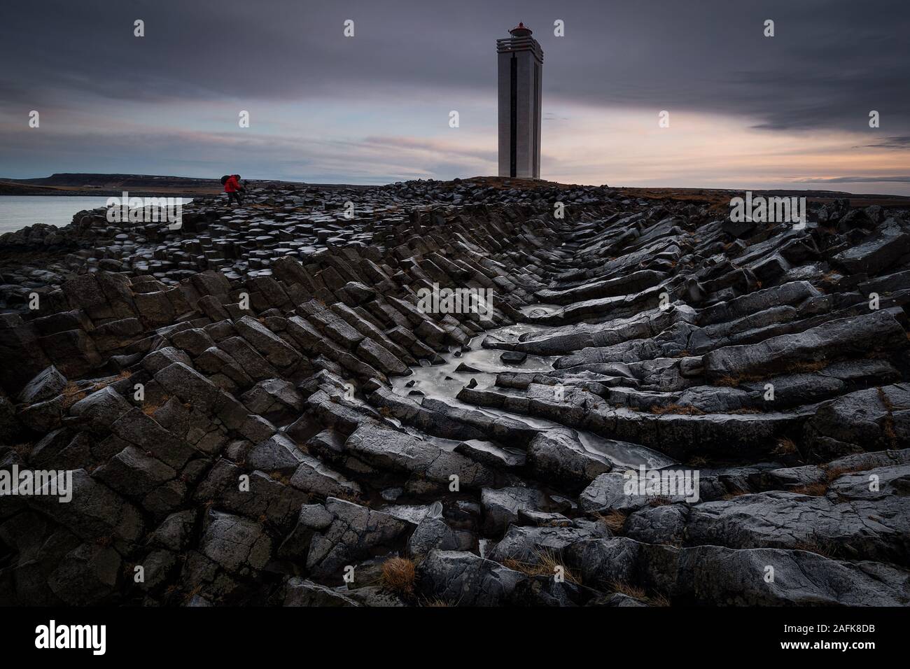 Basaltic columns in Kálfshamarsviti lighthouse in Iceland Stock Photo