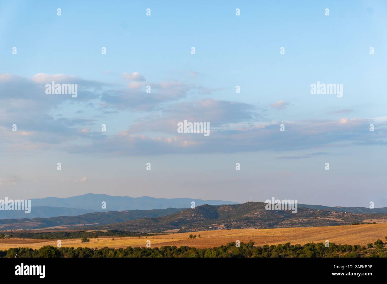 Sky with clouds and yellow fields in Greece horizontal Stock Photo