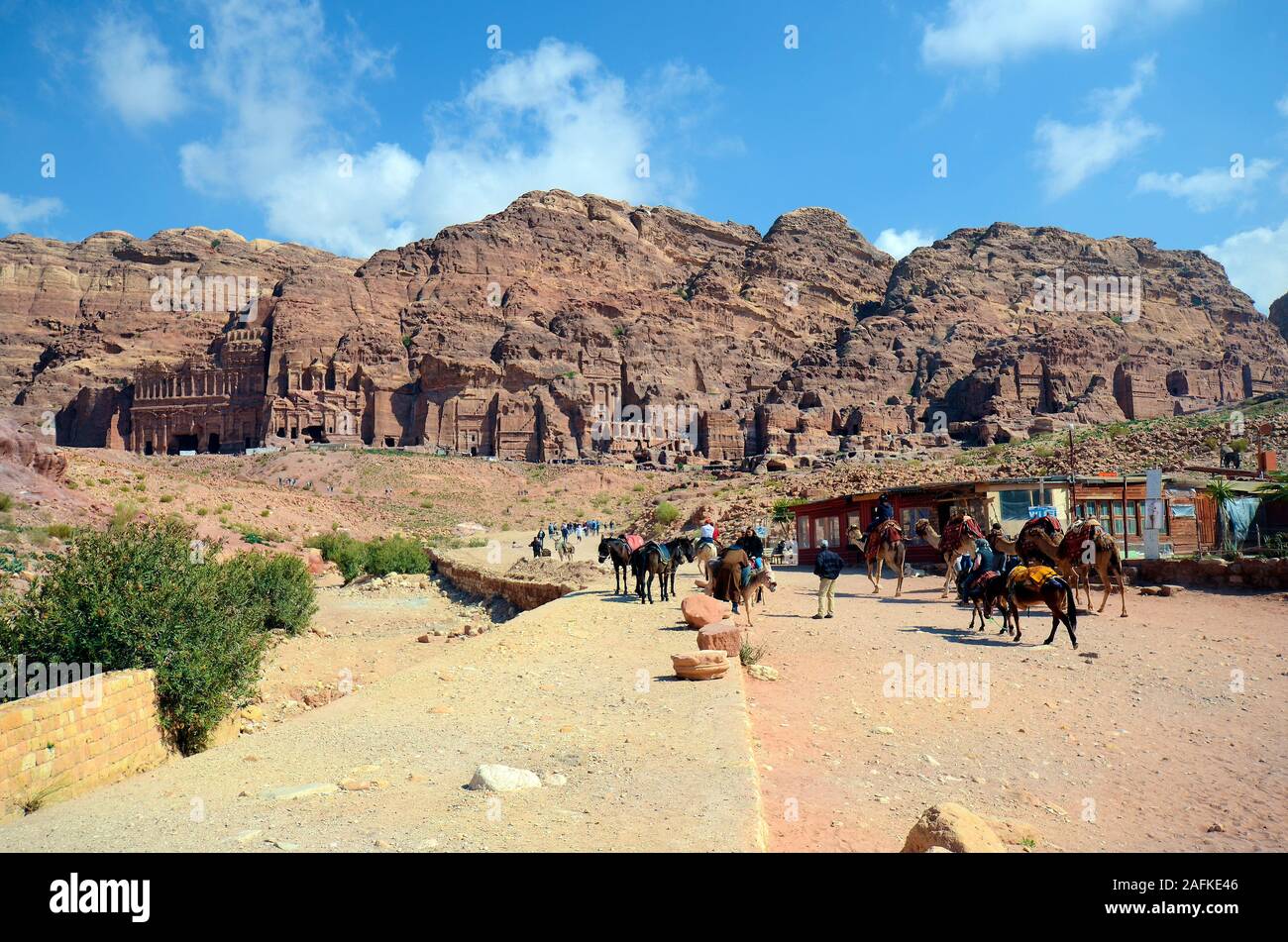 Petra, Jordan - March 06, 2019: Unidentified people, shops, horses and camels in UNESCO World heritage site of ancient Petra Stock Photo